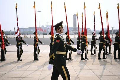 Chinese People's Liberation Army (PLA) honour guard march in front of the Great Hall of the People ahead of a welcome ceremony for US President Donald Trump in Beijing on May 14, 2026. (Photo by Brendan SMIALOWSKI / AFP)<!-- NICAID(16288962) -->