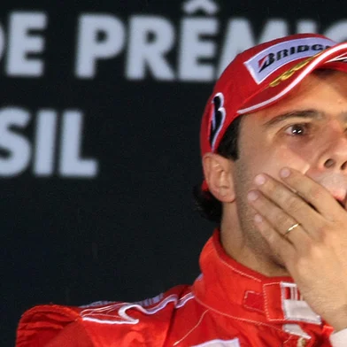 Brazilian Formula One driver Felipe Massa of Ferrari gestures in the podium after winning the Brazilian Gran Prix, at the Interlagos racetrack in Sao Paulo, Brazil, on November 2, 2008. British Lewis Hamilton was crowned Formula One champion after finishing fifth in the race.    AFP PHOTO/ORLANDO KISSNER (Photo by ORLANDO KISSNER / AFP)Editoria: SPOLocal: Sao PauloIndexador: ORLANDO KISSNERSecao: motor racingFonte: AFP<!-- NICAID(15394390) -->