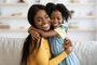 Mother Daughter Love. Happy Black Woman Hugging With Her Child At HomeMother Daughter Love. Happy Black Woman Hugging With Her Child At Home, Loving African American Family Of Two Mom And Female Kid Bonding And Enjoying Spending Time With Each Other, Copy SpaceFonte: 488717410<!-- NICAID(15415361) -->