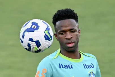 Brazil's national football team forward Vinicius Junior gestures during training session in Brasilia on March 18, 2025, ahead of the FIFA World Cup 2026 qualifier football match against Colombia on March 20. (Photo by EVARISTO SA / AFP)<!-- NICAID(16004636) -->
