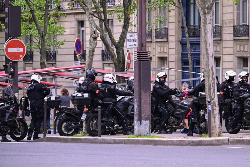 French police officers of the Repression of Violent Action Motorised Brigade (Brav-M or Brigade de repression de l'action violente motorisee) take part in a security perimiter near the consulate of Iran in Paris, as a person was suspected of entering the building with explosives, on April 19, 2024. French authorities on April 19, 2024, detained a man after receiving an alert from the Iranian consulate in Paris that someone had entered carrying an explosive, the capital's police authority said. (Photo by Miguel MEDINA / AFP)<!-- NICAID(15739597) -->