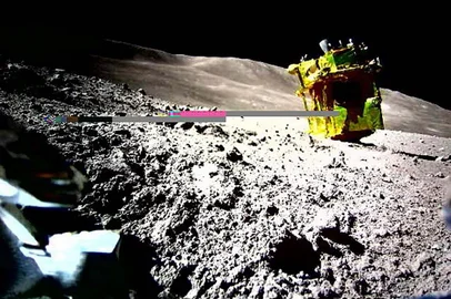 This handout photo released on January 25, 2024 from the Japan Aerospace Exploration Agency (JAXA) and credited to JAXA, Takara Tomy, Sony Group Corporation and Doshisha University shows an image of the lunar surface taken and transmitted by LEV-2 "SORA-Q" the transformable lunar surface robot "SORA-Q" (operation verification model), installed on the private company's lunar module for the Smart Lander for Investigating Moon (SLIM) mission, after landing on the Moon on January 20. Japan's "Moon Sniper" craft landed around 55 metres (180 feet) from its target, the country's space agency said on January 25, 2024 as it released the first images from the mission. (Photo by Handout / various sources / AFP) / -----EDITORS NOTE --- RESTRICTED TO EDITORIAL USE - MANDATORY CREDIT "AFP PHOTO / JAXA/ Takara Tomy / Sony Group Corporation / Doshisha University" - NO MARKETING - NO ADVERTISING CAMPAIGNS - DISTRIBUTED AS A SERVICE TO CLIENTS<!-- NICAID(15659772) -->