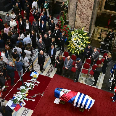 People pay last respects to Uruguay's former President Jose 'Pepe' Mujica as his remains lie in state at the Palacio Legislativo in Montevideo, on May 14, 2025, a day after his death. Uruguay began bidding farewell to its former leader Jose "Pepe" Mujica, a former leftist guerrilla fighter who won global fame for his humility as the so-called "world's poorest president." The 89-year-old, who spent a dozen years behind bars for revolutionary activity, lost a year-long battle against cancer on May 13. (Photo by Pablo PORCIUNCULA / AFP)<!-- NICAID(16037054) -->