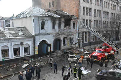 Ukrainian law enforcement officers work at the site of a drone attack that hit a kindergarten in Kharkiv on October 22, 2025, amid the Russian invasion of Ukraine. (Photo by SERGEY BOBOK / AFP)<!-- NICAID(16151233) -->