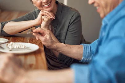 Cheerful aged couple enjoying meeting in cafeEnjoyable meeting. Waist up portrait of cheerful aged woman looking with love to her male friend while enjoying meeting in cafeIndexador: Yaroslav AstakhovFonte: 262787044<!-- NICAID(14408815) -->
