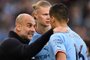 Manchester City's Spanish manager Pep Guardiola (L) speaks to Manchester City's Norwegian striker Erling Haaland (C) and Manchester City's Spanish midfielder Rodri during the English Premier League football match between Manchester City and West Ham at the Etihad Stadium in Manchester, north west England, on May 3, 2023. (Photo by Oli SCARFF / AFP) / RESTRICTED TO EDITORIAL USE. No use with unauthorized audio, video, data, fixture lists, club/league logos or 'live' services. Online in-match use limited to 120 images. An additional 40 images may be used in extra time. No video emulation. Social media in-match use limited to 120 images. An additional 40 images may be used in extra time. No use in betting publications, games or single club/league/player publications. / <!-- NICAID(15427130) -->