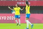 Brazil's midfielder Marta (L) celebrates after scoring her second goal, team's third, during the Tokyo 2020 Olympic Games women's group F first round football match between China and Brazil at the Miyagi Stadium in Miyagi on July 21, 2021. (Photo by Kohei CHIBAHARA / AFP)<!-- NICAID(14849214) -->