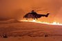This handout image shows an Icelandic Coast Guard helicopter overflying an volcanic eruption on the Reykjanes peninsula 3 km north of Grindavik, western Iceland on December 19, 2023. A volcanic eruption began on Monday night in Iceland, south of the capital Reykjavik, following an earthquake swarm, Iceland's Meteorological Office reported. (Photo by Icelandic Coast Guard / HANDOUT / AFP) / RESTRICTED TO EDITORIAL USE - MANDATORY CREDIT "AFP PHOTO /   " - NO MARKETING NO ADVERTISING CAMPAIGNS - DISTRIBUTED AS A SERVICE TO CLIENTSEditoria: ENVLocal: GrindavikIndexador: ICELANDIC COAST GUARDSecao: environmental politicsFonte: HANDOUTFotógrafo: Handout<!-- NICAID(15629714) -->