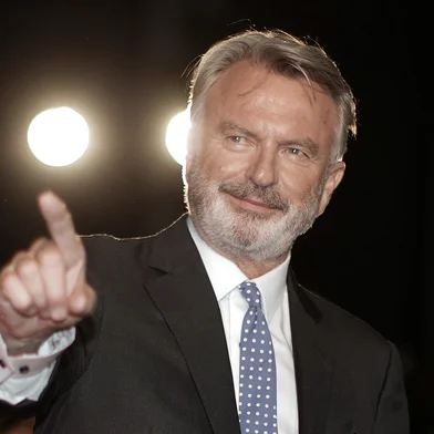 (FILES) Actor Sam Neill arrives for the premiere of "Blackbird" during the Toronto International Film Festival in Toronto, Ontario on September 6, 2019. "Jurassic Park" star Sam Neill died in Australia on July 13, 2026 aged 78, according to a family statement that described his death as "sudden and unexpected". (Photo by Geoff Robins / AFP)Editoria: ACELocal: TorontoIndexador: GEOFF ROBINSSecao: cinemaFonte: AFPFotógrafo: STR<!-- NICAID(16328021) -->