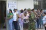 People queue to vote at a polling station during a referendum on tougher measures against organized crime in Olon, Santa Elena province, Ecuador, on April 21, 2024. Ecuadorans began voting Sunday in a referendum on proposed tougher measures to fight gang-related crime. The once-peaceful South American country has been grappling with a shocking rise in violence that has seen two mayors killed this week. (Photo by Gerardo MENOSCAL / AFP)<!-- NICAID(15740756) -->