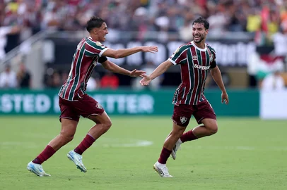 ORLANDO, FLORIDA - JULY 04: Matheus Martinelli #8 of Fluminense FC celebrates scoring his team's first goal with team mate Facundo Bernal #5 of Fluminense FC during the FIFA Club World Cup 2025 quarter final match between Fluminense FC and Al Hilal at Camping World Stadium on July 04, 2025 in Orlando, Florida.   Megan Briggs/Getty Images/AFP (Photo by Megan Briggs / GETTY IMAGES NORTH AMERICA / Getty Images via AFP)<!-- NICAID(16073769) -->