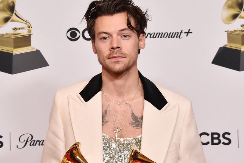 LOS ANGELES, CALIFORNIA - FEBRUARY 05: Harry Styles poses with the Best Pop Vocal Album Award for Harrys House and Album of the Year Award for Harrys House in the press room during the 65th GRAMMY Awards at Crypto.com Arena on February 05, 2023 in Los Angeles, California.   Alberto E. Rodriguez/Getty Images for The Recording Academy/AFP (Photo by Alberto E. Rodriguez / GETTY IMAGES NORTH AMERICA / Getty Images via AFP)<!-- NICAID(15341002) -->