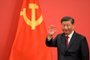 China's President Xi Jinping waves during the introduction of members of the Chinese Communist Party's new Politburo Standing Committee, the nation's top decision-making body, to the media in the Great Hall of the People in Beijing on October 23, 2022. (Photo by WANG Zhao / AFP)<!-- NICAID(15243361) -->