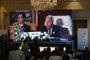 Journalists watch a large screen showing the Brazilian Foreign Minister Mauro Vieira addressing the International Peace Summit hosted by the Egyptian president in Cairo on October 21, 2023, amid the ongoing battles between Israel and the Palestinian group Hamas. Thousands of people, both Israeli and Palestinians have died since October 7, 2023, after Palestinian Hamas militants based in the Gaza Strip, entered southern Israel in a surprise attack leading Israel to declare war on Hamas in Gaza on October 8. (Photo by Khaled DESOUKI / AFP)<!-- NICAID(15575539) -->