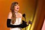 US singer-songwriter Taylor Swift accepts the Best Pop Vocal Album award for "Midnights" on stage during the 66th Annual Grammy Awards at the Crypto.com Arena in Los Angeles on February 4, 2024. (Photo by Valerie Macon / AFP)<!-- NICAID(15669785) -->