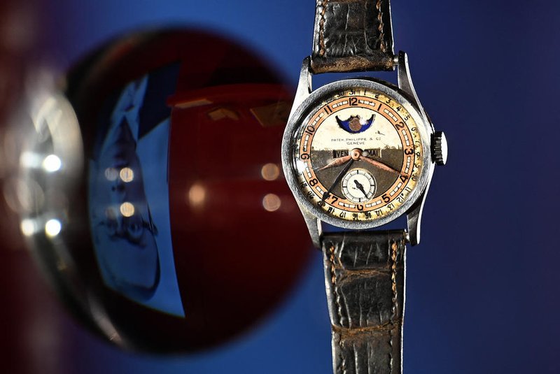 The Patek Philippe Ref 96 Quantieme Lune timepiece once owned by Aisin-Gioro Puyi, the Chinese Qing dynastys last emperor (L), is seen on display in Hong Kong on May 23, 2023 ahead of its auction in the territory on the same day. The most expensive watch ever sold at auction was a super-complicated Patek Philippe Grandmaster Chime, which  sold for US$31 million in 2019. (Photo by Peter PARKS / AFP)<!-- NICAID(15435822) -->