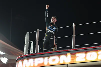 World champion and race third-placed McLaren's British driver Lando Norris celebrates at the end of the Abu Dhabi Formula One Grand Prix at the Yas Marina Circuit in Abu Dhabi on December 7, 2025. (Photo by Fadel SENNA / AFP)<!-- NICAID(16181812) -->