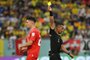 Slovenian referee Ivan Barton (R) gives a yellow card to Switzerland's midfielder #20 Fabian Frei during the Qatar 2022 World Cup Group G football match between Brazil and Switzerland at Stadium 974 in Doha on November 28, 2022. (Photo by NELSON ALMEIDA / AFP)Editoria: SPOLocal: DohaIndexador: NELSON ALMEIDASecao: soccerFonte: AFPFotógrafo: STF<!-- NICAID(15279080) -->