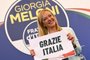 Leader of Italian far-right party "Fratelli d'Italia" (Brothers of Italy), Giorgia Meloni holds a placard reading "Thank You Italy" after she delivered an address at her party's campaign headquarters overnight on September 26, 2022 in Rome, after the country voted in a legislative election. - Far-right leader Giorgia Meloni won big in Italian elections on September 25, the first projections suggested, putting her eurosceptic populists on course to take power at the heart of Europe. (Photo by Andreas SOLARO / AFP)Editoria: POLLocal: RomeIndexador: ANDREAS SOLAROSecao: electionFonte: AFPFotógrafo: STF<!-- NICAID(15216918) -->