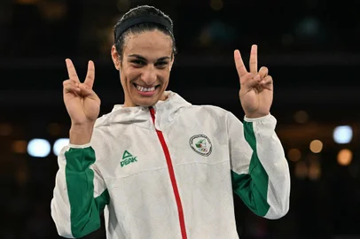 Gold medallist Algeria's Imane Khelif poses on the podium during the medal ceremony for the women's 66kg final boxing category during the Paris 2024 Olympic Games at the Roland-Garros Stadium, in Paris on August 9, 2024. (Photo by MOHD RASFAN / AFP)<!-- NICAID(15837411) -->