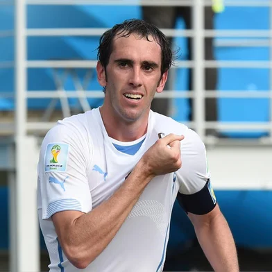 491716713Uruguay's defender Diego Godin celebrates after scoring during a Group D football match between Italy and Uruguay at the Dunas Arena in Natal during the 2014 FIFA World Cup on June 24, 2014.   AFP PHOTO/ JAVIER SORIANOEditoria: SPOLocal: NatalIndexador: JAVIER SORIANOSecao: SoccerFonte: AFPFotógrafo: STF<!-- NICAID(10644791) -->