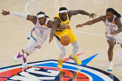OKLAHOMA CITY, OK - JUNE 5: Luguentz Dort #5 of the Oklahoma City Thunder and Pascal Siakam #43 of the Indiana Pacers battle for the ball during Game One of the 2025 NBA Finals on June 5, 2025 at Paycom Center in Oklahoma City, Oklahoma. NOTE TO :  expressly acknowledges and agrees that, by ing and or using this photograph,  is consenting to the  and conditions of the Getty Images License Agreement. Mandatory Copyright Notice: Copyright 2025 NBAE   Ron Hoskins/NBAE via Getty Images/AFP (Photo by Ron Hoskins / NBAE / Getty Images / Getty Images via AFP)<!-- NICAID(16057069) -->