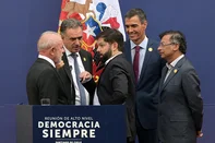 (L to R) Brazil's President Luiz Inacio Lula da Silva, Uruguay's President Yamandu Orsi, Chile's President Gabriel Boric, Spanish Prime Minister Pedro Sanchez, and Colombia's President Gustavo Petro talk after giving a joint statement during the "Democracy Always" high-level summit at the Palacio de la Moneda in Santiago on July 21, 2025. (Photo by Rodrigo ARANGUA / AFP)<!-- NICAID(16084735) -->