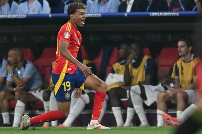 Spain's forward #19 Lamine Yamal celebrates scoring his team's first goal during the UEFA Euro 2024 semi-final football match between Spain and France at the Munich Football Arena in Munich on July 9, 2024. (Photo by MIGUEL MEDINA / AFP)<!-- NICAID(15809843) -->