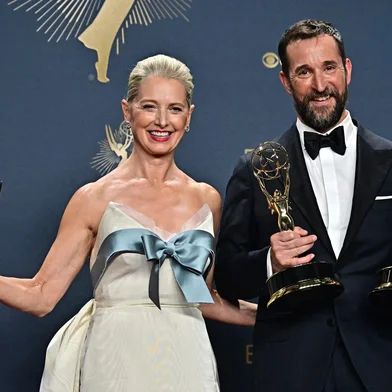 US actress Katherine LaNasa (L) and US actor Noah Wyle pose in the press room with the award for Outstanding Supporting Actress in a Drama Series, Outstanding Lead Actor in a Drama Series, Outstanding Drama Series for "The Pitt" during the 77th Primetime Emmy Awards at the Peacock Theatre at LA Live in Los Angeles on September 14, 2025. (Photo by Frederic J. Brown / AFP) / RESTRICTED TO EDITORIAL USE<!-- NICAID(16124200) -->