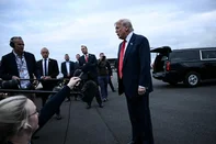 US President Donald Trump speaks to the press after disembarking from Air Force One upon his arrival at Prestwick Airport, south of Glasgow on July 25, 2025, on the first day of his UK visit. US President Donald Trump departed for Scotland on July 25, 2025 for a mix of diplomacy, business and leisure, as a huge UK security operation swung into place amid planned protests near his family-owned golf resorts. (Photo by Brendan SMIALOWSKI / AFP)<!-- NICAID(16088255) -->