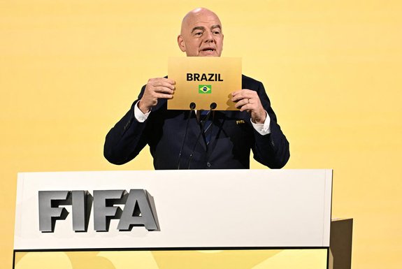 FIFA President Gianni Infantino announces Brazil as the hosts of the 2027 Women's World Cup during the 74th FIFA Congress in Bangkok on May 17, 2024. The 74th FIFA Congress is taking place in Bangkok with member associations voting on a range of issues including confirmation of the host nation or nations for the 2027 women's football World Cup. (Photo by Manan VATSYAYANA / AFP)<!-- NICAID(15766500) -->