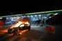 A vehicle burns at a gas station following clashes between riot police and supporters of President Jair Bolsonaro protesting the arrest of an indigenous leader in Brasilia, on December 12, 2022. (Photo by EVARISTO SA / AFP)<!-- NICAID(15293616) -->