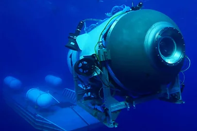 This undated image courtesy of OceanGate Expeditions, shows their Titan submersible launching from a platform. Rescue teams expanded their search underwater on June 20, 2023, as they raced against time to find a Titan deep-diving tourist submersible that went missing near the wreck of the Titanic with five people on board and limited oxygen. All communication was lost with the 21-foot (6.5-meter) Titan craft during a descent June 18 to the Titanic, which sits at a depth of crushing pressure more than two miles (nearly four kilometers) below the surface of the North Atlantic. (Photo by Handout / OceanGate Expeditions / AFP) / RESTRICTED TO EDITORIAL USE - MANDATORY CREDIT "AFP PHOTO / OceanGate Expeditions" - NO MARKETING NO ADVERTISING CAMPAIGNS - DISTRIBUTED AS A SERVICE TO CLIENTS<!-- NICAID(15462062) -->