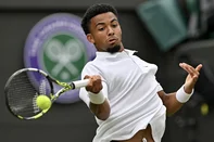(FILES) France's Arthur Fils returns against Australia's Alex De Minaur during their men's singles fourth round tennis match on the eighth day of the 2024 Wimbledon Championships at The All England Lawn Tennis and Croquet Club in Wimbledon, southwest London, on July 8, 2024. French number one Arthur Fils officially withdrew on June 21, 2025, from the Wimbledon tournament (June 30 - July 13), not fully recovered from a back injury that forced him to give up at the end of May at Roland-Garros. (Photo by Glyn KIRK / AFP) / RESTRICTED TO EDITORIAL USE<!-- NICAID(16068908) -->