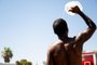 PHOENIX, ARIZONA - JULY 16: A person cools off amid searing heat that was forecast to reach 115 degrees Fahrenheit on July 16, 2023 in Phoenix, Arizona. A heat dome over Texas that has expanded to California, Nevada and Arizona is subjecting millions of Americans to excessive heat warnings, according to the National Weather Service.   Brandon Bell/Getty Images/AFP (Photo by Brandon Bell / GETTY IMAGES NORTH AMERICA / Getty Images via AFP)<!-- NICAID(15484330) -->