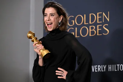 Brazilian actress Fernanda Torres poses with the Best Performance by a Female Actor in a Motion Picture  Drama award for "I'm Still Here" in the press room during the 82nd annual Golden Globe Awards at the Beverly Hilton hotel in Beverly Hills, California, on January 5, 2025. (Photo by Robyn Beck / AFP)<!-- NICAID(15947869) -->