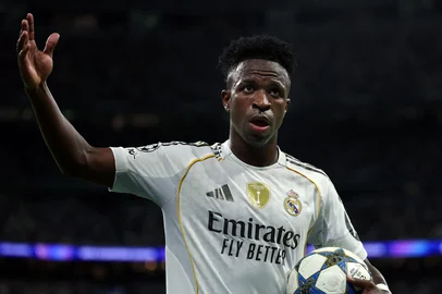 Real Madrid's Brazilian forward #07 Vinicius Junior reacts during the UEFA Champions League league phase day 3 football match between Real Madrid CF and Juventus at Santiago Bernabeu Stadium in Madrid on October 22, 2025. (Photo by Thomas COEX / AFP)<!-- NICAID(16156390) -->