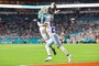 MIAMI GARDENS, FLORIDA - DECEMBER 24: Cedrick Wilson Jr. #11 of the Miami Dolphins catches a pass in front of Stephon Gilmore #21 of the Dallas Cowboys during a game at Hard Rock Stadium on December 24, 2023 in Miami Gardens, Florida. The Dolphins defeated the Cowboys 22-20. Stacy Revere/Getty Images/AFP
