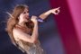 (FILES) US singer-songwriter Taylor Swift performs during her Eras Tour at Sofi stadium in Inglewood, California, August 7, 2023. French rapper SCH's July 22, 2023, concert at Marseille's Velodrome stadium, filmed with some 70 cameras, will be programmed as a single screening on November 23, 2023, in 200 cinemas in France, Switzerland and Belgium. The screenings follow in the footsteps of artists OrelSan, Taylor Swift, - M - and Beyonce, who have carried out similar events. (Photo by Michael Tran / AFP) / RESTRICTED TO EDITORIAL USE<!-- NICAID(15604554) -->