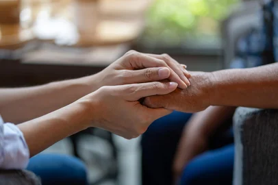 Hand of younger woman holding hand elderly woman, Helping hands, Take care for the elderly concept.<!-- NICAID(16174765) -->