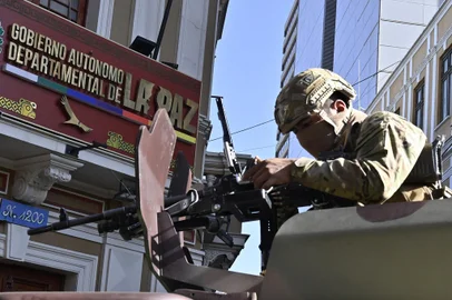 A soldier in an armored vehicle is deployed outside the Quemado Palace at the Plaza Murillo in La Paz on June 26, 2024. Bolivian President Luis Arce on Wednesday denounced the unauthorized gathering of soldiers and tanks outside government buildings in the capital La Paz, saying "democracy must be respected." "We denounce irregular mobilizations by some units of the Bolivian Army," Arce wrote on the X social network. Former president Evo Morales wrote on the same medium that "a coup d'état is brewing." (Photo by AIZAR RALDES / AFP)<!-- NICAID(15798864) -->
