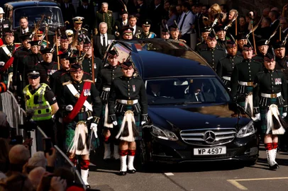 Britain's King Charles III, flanked by Britain's Princess Anne, Princess Royal, Britain's Prince Andrew, Duke of York and Britain's Prince Edward, Earl of Wessex walk behind the procession of Queen Elizabeth II's coffin, from the Palace of Holyroodhouse to St Giles Cathedral, on the Royal Mile on September 12, 2022, where Queen Elizabeth II will lie at rest. - Mourners will on Monday get the first opportunity to pay respects before the coffin of Queen Elizabeth II, as it lies in an Edinburgh cathedral where King Charles III will preside over a vigil. (Photo by Odd ANDERSEN / POOL / AFP)<!-- NICAID(15203654) -->