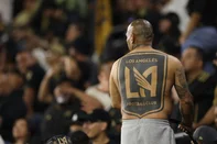 LOS ANGELES, CALIFORNIA - MAY 31: Los Angeles FC fan back tattoo during the FIFA Club World Cup 2025 Play-In match between Los Angeles Football Club and Club America at BMO Stadium on May 31, 2025 in Los Angeles, California.   Luke Hales/Getty Images/AFP (Photo by Luke Hales / GETTY IMAGES NORTH AMERICA / Getty Images via AFP)<!-- NICAID(16052894) -->
