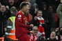 Liverpool's Brazilian striker Roberto Firmino celebrates after scoring their seventh goal during the English Premier League football match between Liverpool and Manchester United at Anfield in Liverpool, north west England on March 5, 2023. - Liverpool won the game 7-0. (Photo by Paul ELLIS / AFP) / RESTRICTED TO EDITORIAL USE. No use with unauthorized audio, video, data, fixture lists, club/league logos or 'live' services. Online in-match use limited to 120 images. An additional 40 images may be used in extra time. No video emulation. Social media in-match use limited to 120 images. An additional 40 images may be used in extra time. No use in betting publications, games or single club/league/player publications. / Editoria: SPOLocal: LiverpoolIndexador: PAUL ELLISSecao: soccerFonte: AFPFotógrafo: STF<!-- NICAID(15366953) -->