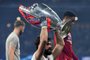 Liverpool's Brazilian goalkeeper Alisson raises the European Champion Clubs' Cup as he celebrates after winning the UEFA Champions League final football match between Liverpool and Tottenham Hotspur at the Wanda Metropolitano Stadium in Madrid on June 1, 2019. (Photo by Paul ELLIS / AFP)<!-- NICAID(14104529) -->
