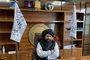 In this photograph taken on September 5, 2021, Taliban commander Mullah Neda Mohammad watches during an interview with AFP at his office in Jalalabad. - As a Taliban commander, he spent years battling the former Afghan government. Now, with his hardline movement back in power, Mohammad vows to continue fighting against rival jihadists, the Islamic State (IS) group. (Photo by JAMES EDGAR / AFP)<!-- NICAID(14882150) -->