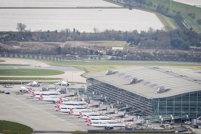 An aerial photograph taken on March 21, 2025 shows planes parked on the tarmac of Heathrow Airport following its closure after a fire broke out at a substation supplying power of the airport, in Hayes, west London. Britain's Heathrow airport, Europe's busiest, was shut down early on March 21 for 24 hours after a major fire at an electricity substation cut power to the sprawling facility west of London, officials said. (Photo by AFP)<!-- NICAID(16001261) -->