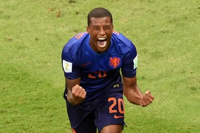 491932375Netherlands' midfielder Georginio Wijnaldum celebrates after scoring a goal during the third place play-off football match between Brazil and Netherlands during the 2014 FIFA World Cup at the National Stadium in Brasilia on July 12, 2014. AFP PHOTO / EVARISTO SAEditoria: SPOLocal: BrasíliaIndexador: EVARISTO SASecao: SoccerFonte: AFPFotógrafo: STF