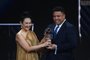 Brazilian former football player Ronaldo (R) hands an award to the widow of Brazilian football legend Pele, Marcia Aoki (L), during a tribute to Pele at the Best FIFA Football Awards 2022 ceremony in Paris on February 27, 2023. (Photo by FRANCK FIFE / AFP)<!-- NICAID(15361334) -->
