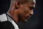 Juventus' Brazilian forward Douglas Costa looks on during the Italian Cup (Coppa Italia) round of 8 football match Juventus vs AS Roma on January 22, 2020 at the Juventus stadium in Turin. - The tattoo on his neck reads "Resilience" in Portuguese. (Photo by Marco Bertorello / AFP)Editoria: SPOLocal: TurinIndexador: MARCO BERTORELLOSecao: soccerFonte: AFPFotógrafo: STF<!-- NICAID(14768095) -->